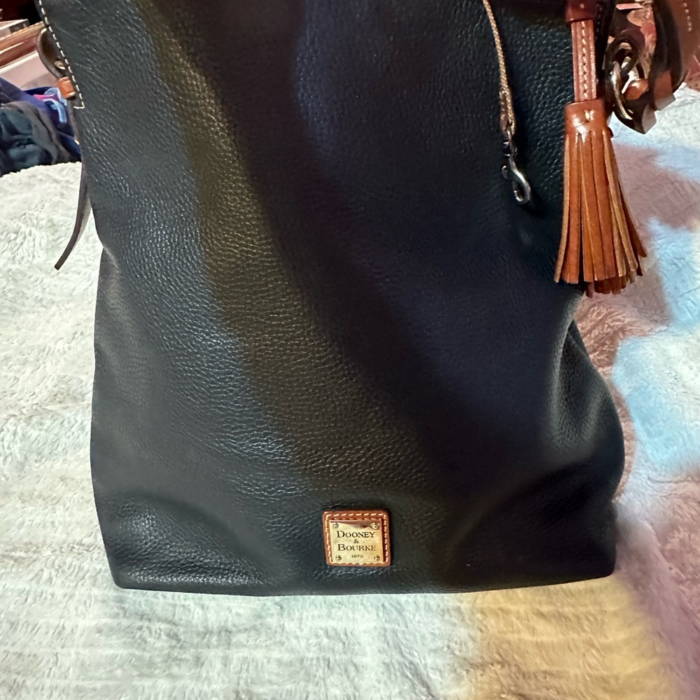 Very nice Dooney & Bourke handbag was only used once for a couple of hours
